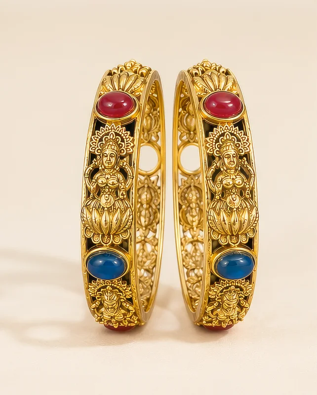 Ornate gold bangles with gemstones